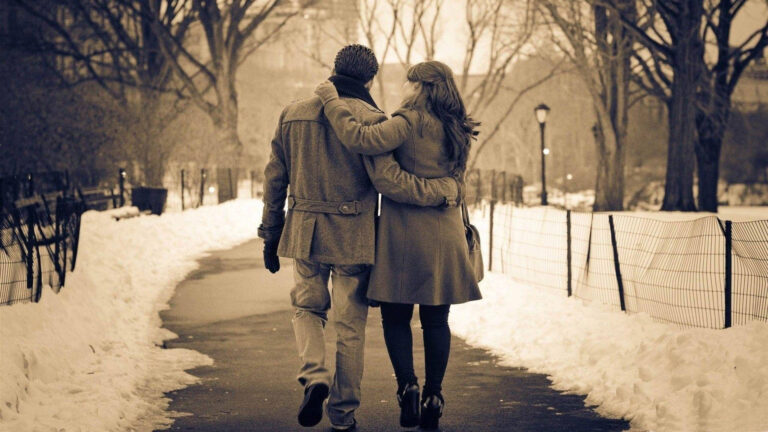 couples walking togther in snow